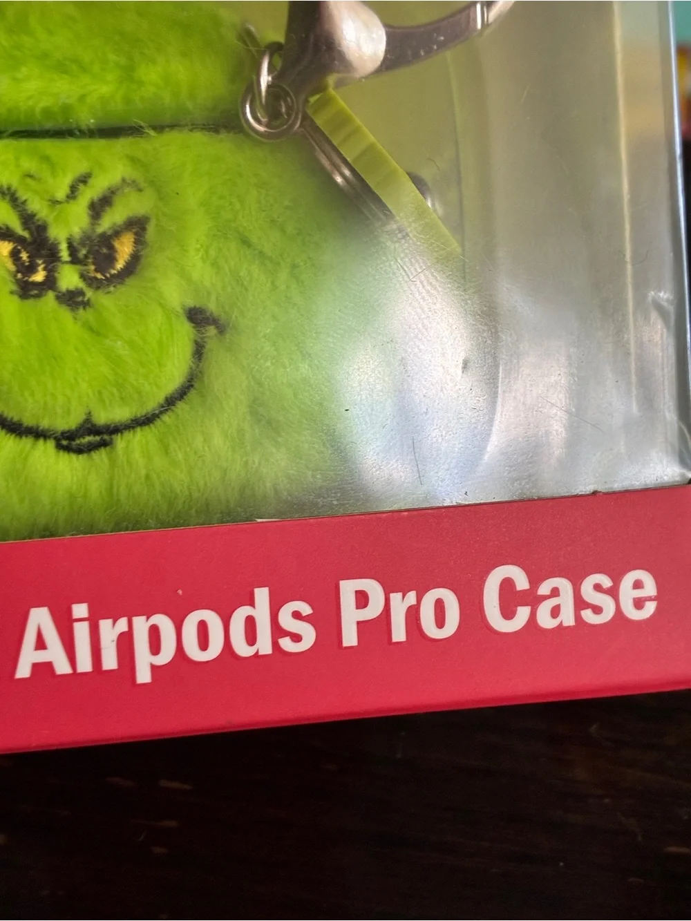 The Grinch Plush AirPods Pro Case in Bright Green with Keyring
